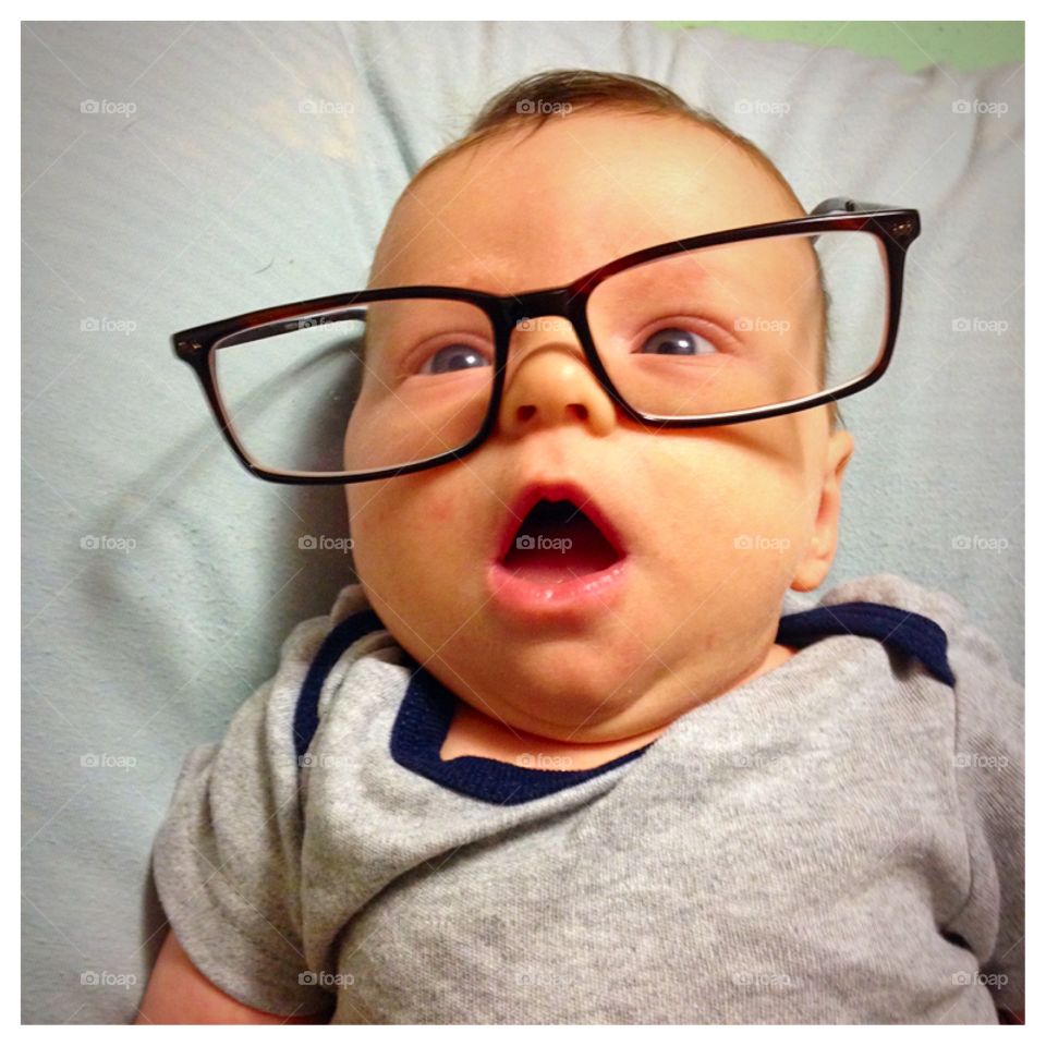 Smarty Pants. Baby wearing dark framed glasses 