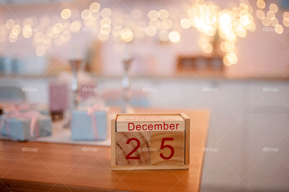 Christmas background with wooden block calendar with the date of December 25