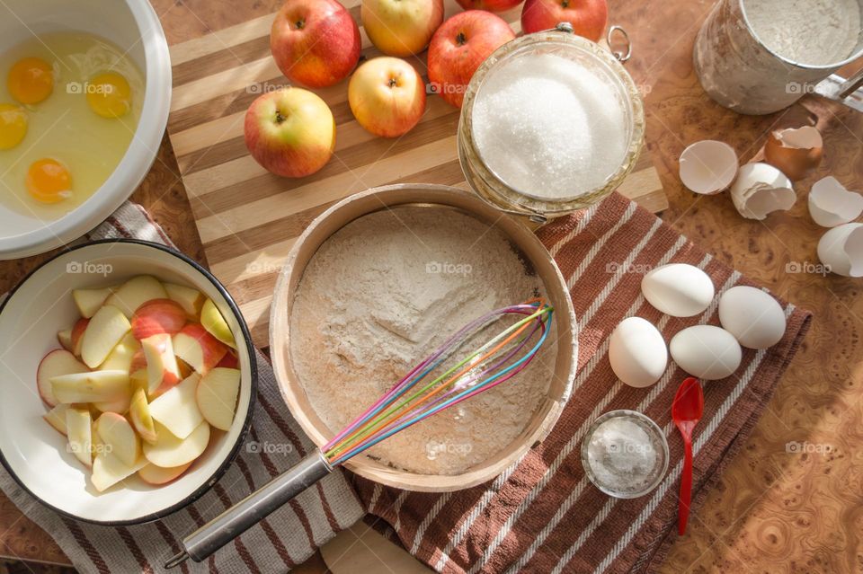 Making homemade puffed apple pie with eggs, sugar and flour.
