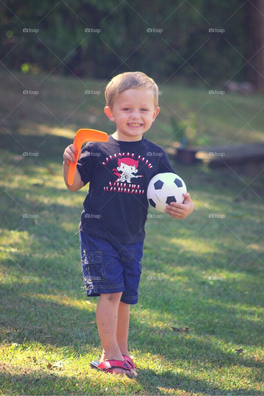 Portrait of smiling boy with soccer ball
