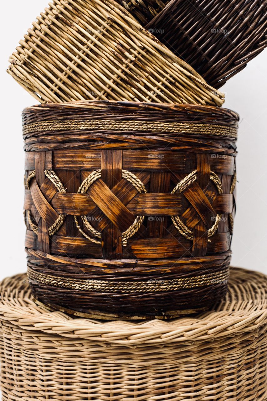 Straw baskets at white background 