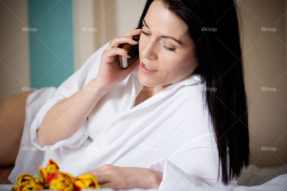 Young woman talking on mobile phone