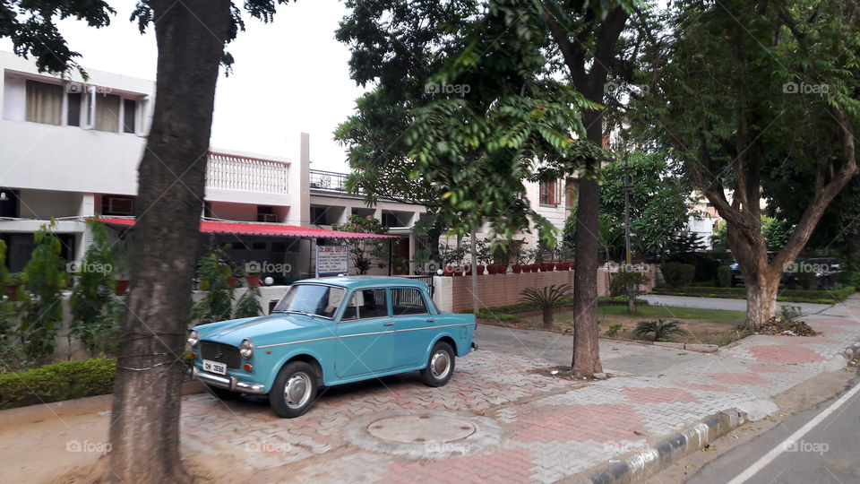 Old model blue Fiat car, a luxury in its time.