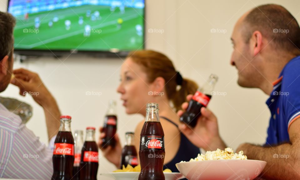 Friends who drink Coca-Cola