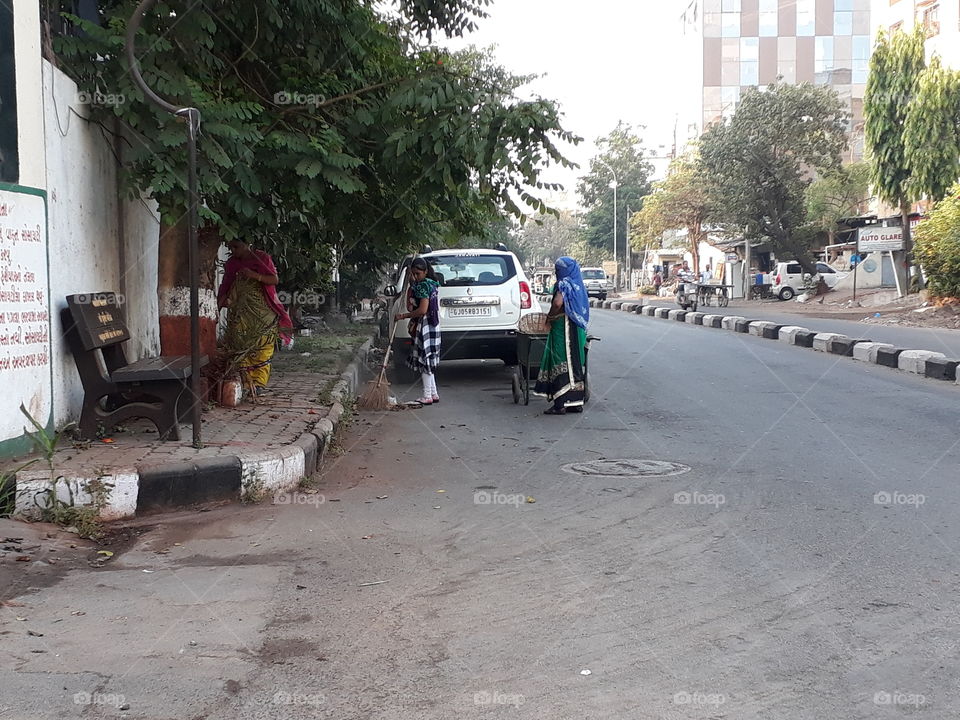 Road cleaning women in the morning
