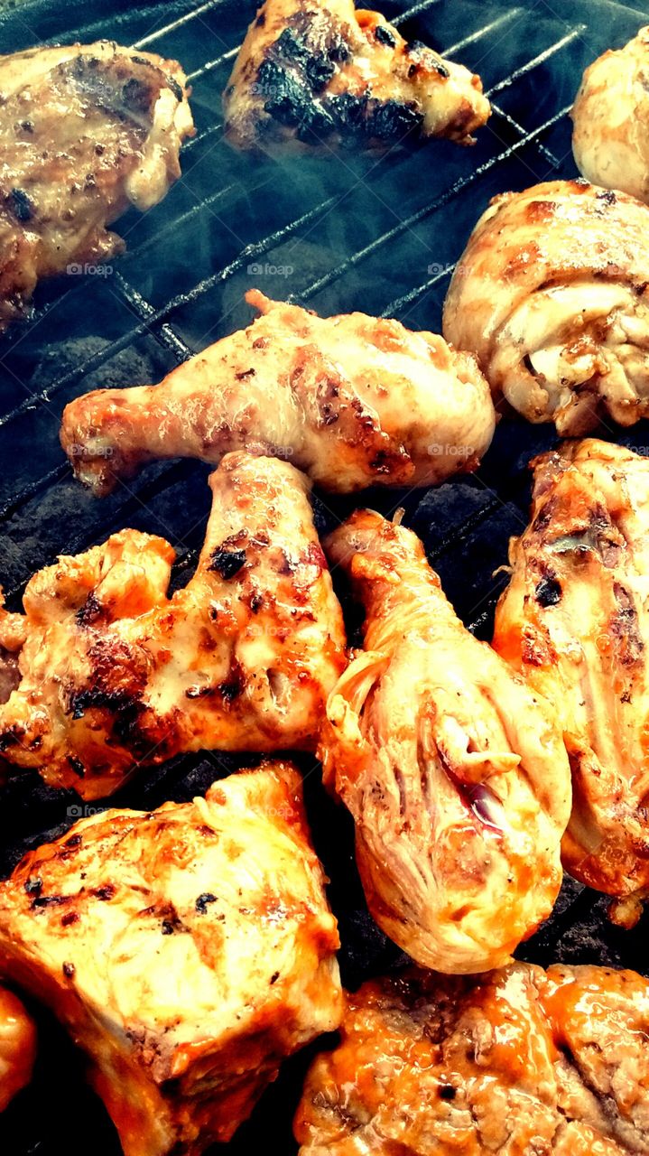barbecue chicken. chicken cooked on an open fire 