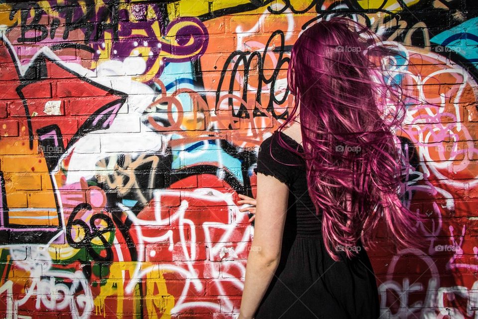 Girl in front of Graffiti 