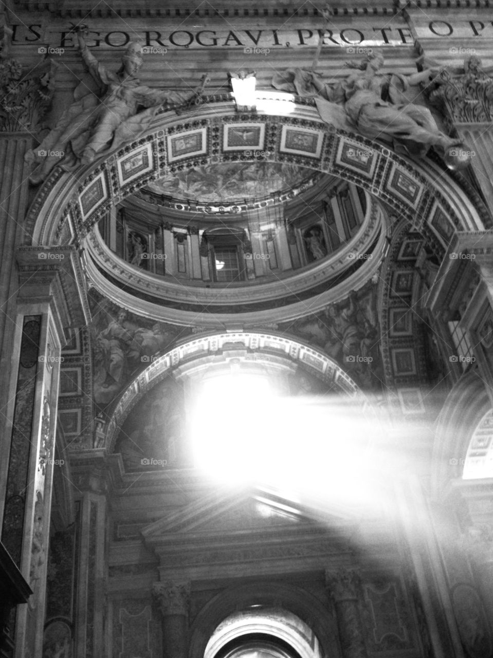 The sun shines throug a window at the St. Peter Cathedral in the Vatican