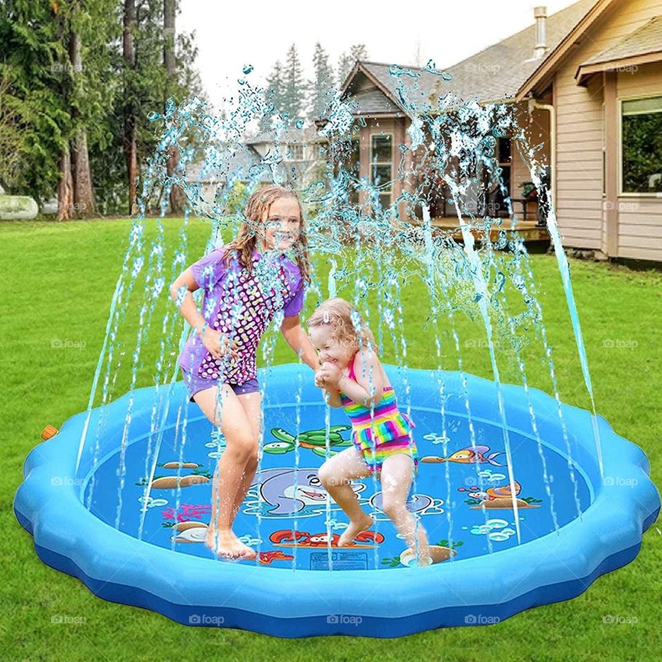 Two kids playing splash water