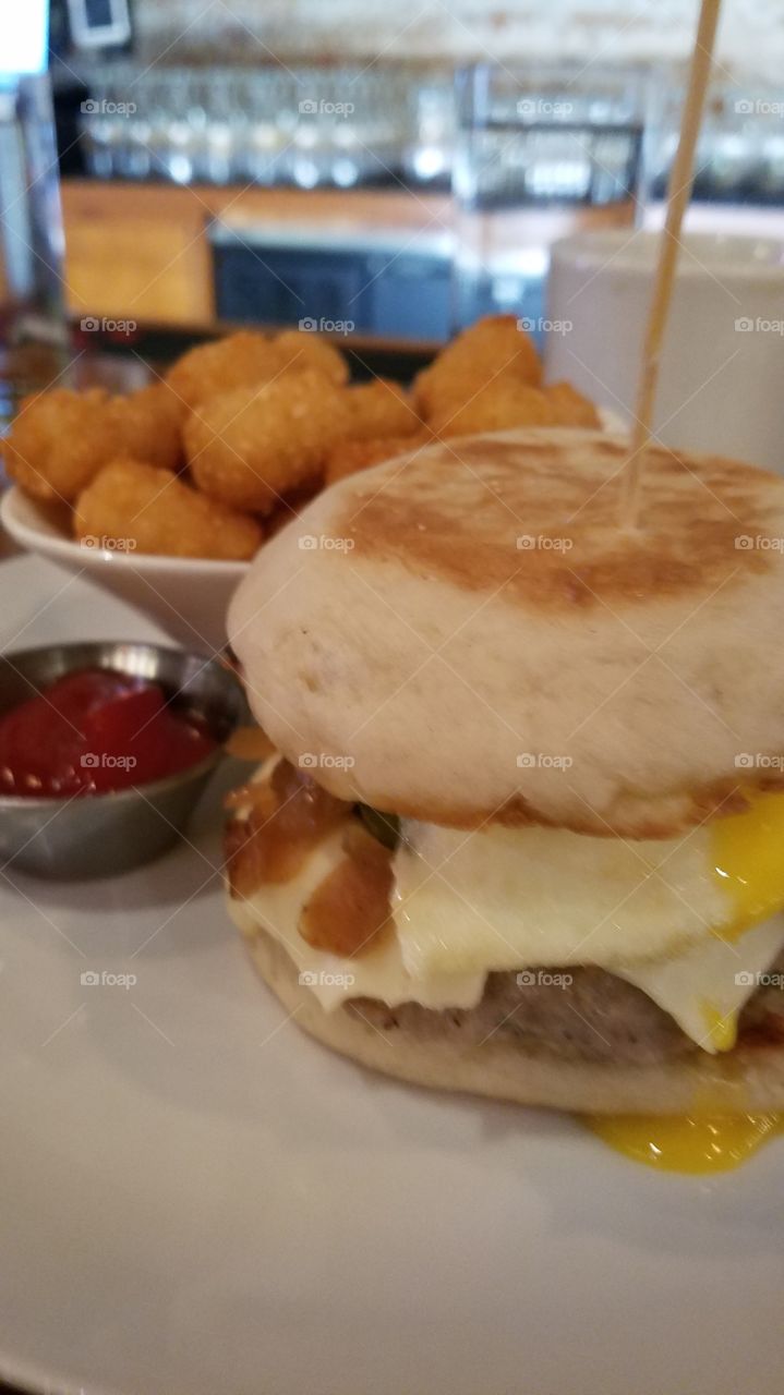 breakfast sandwich with egg and tator tota