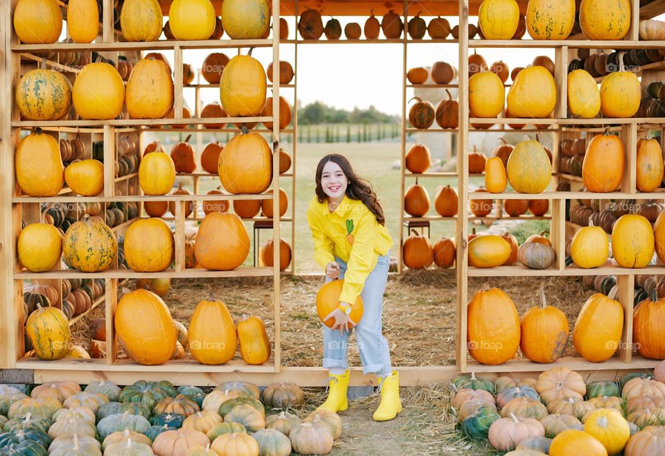 Girl in pumpkin farm 