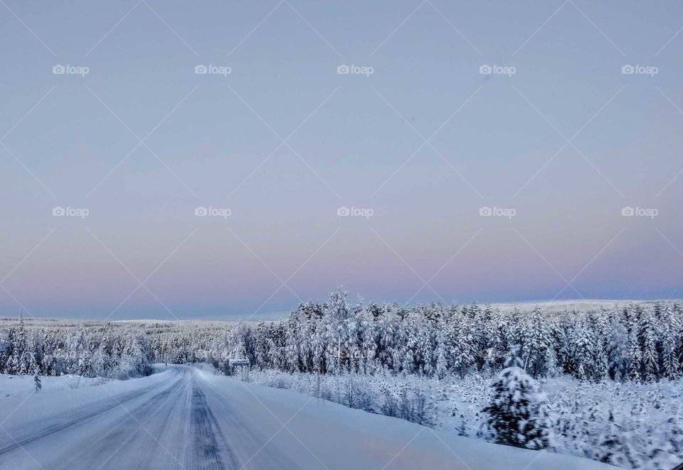 Road in the winter around sunset, Northern Finland