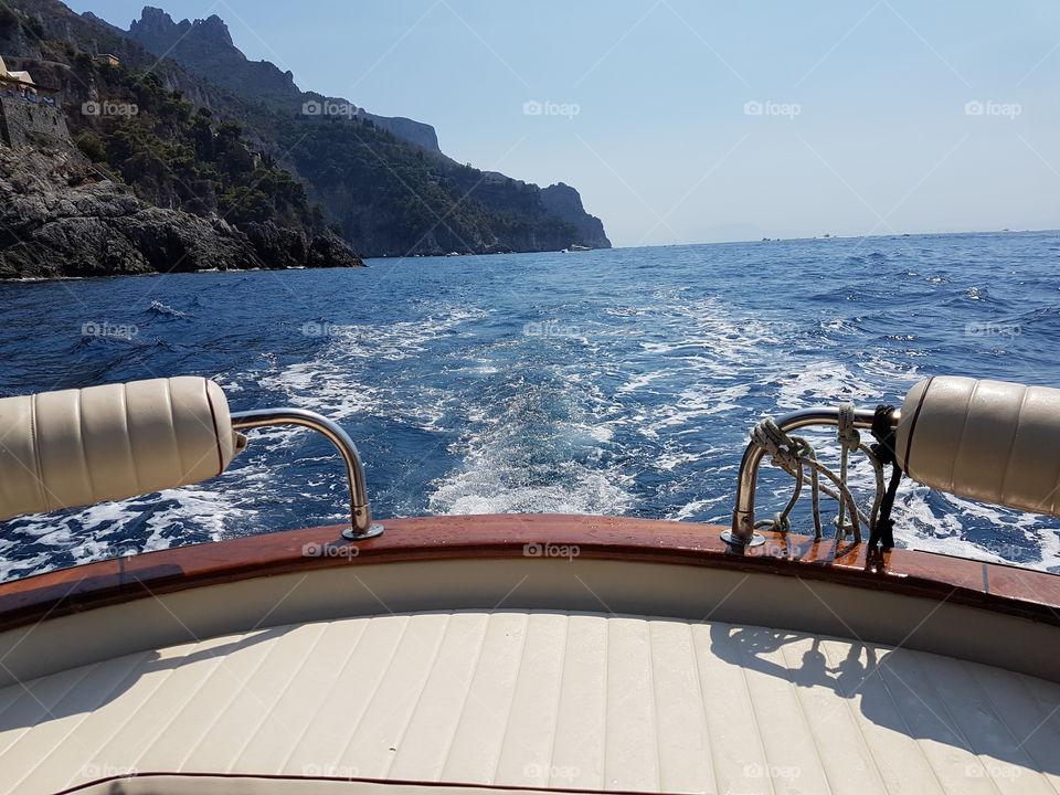 Sea, boat, sun and blue sky