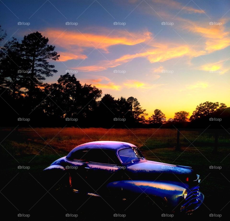 sunset on old car