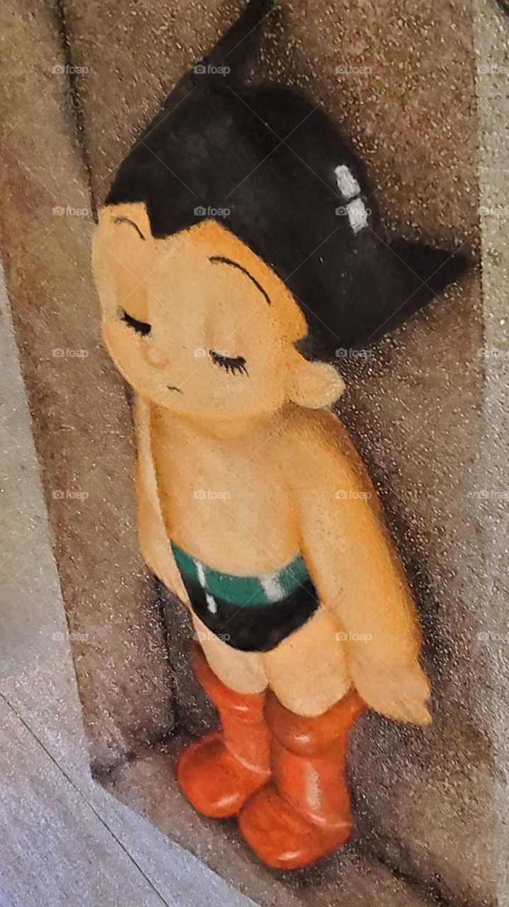 Street art of the beloved AstroBoy, a robot who has the heart of a boy.