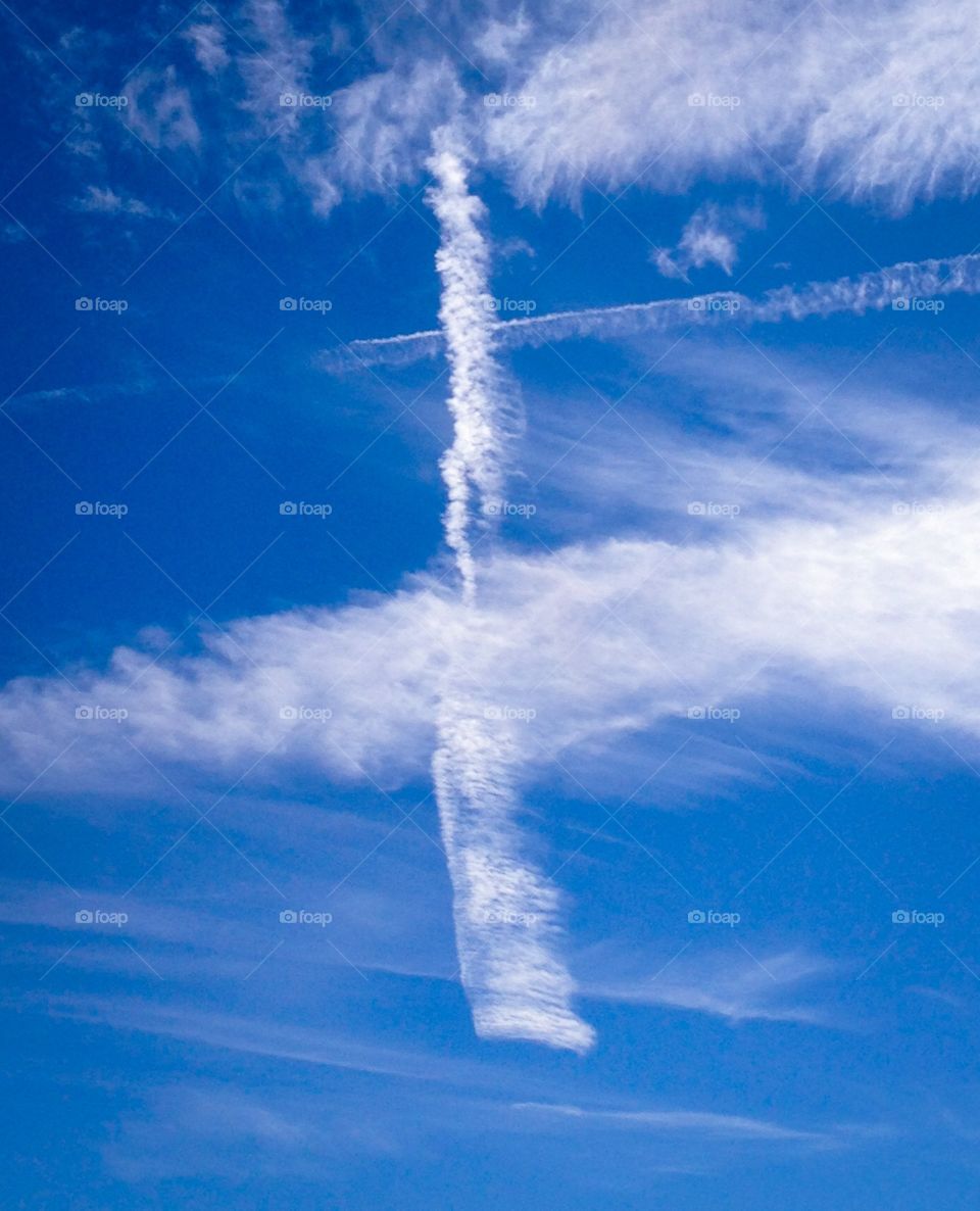 Cross of clouds in the sky