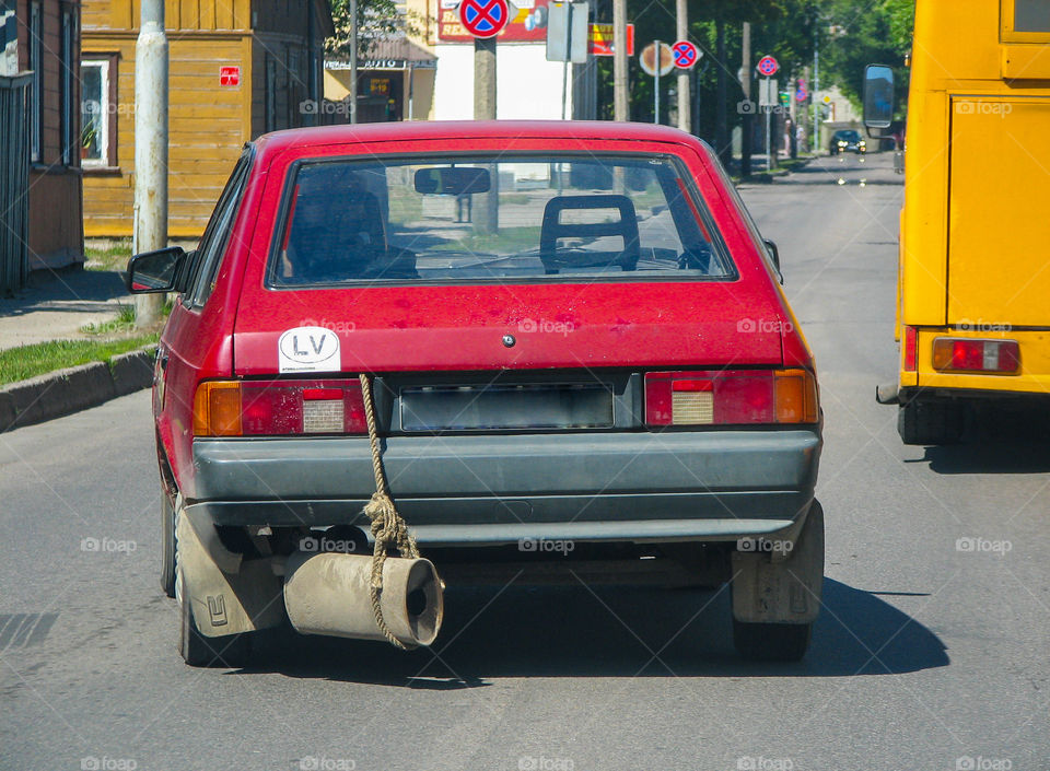 exhaust pipe defect vehicle drive along the street