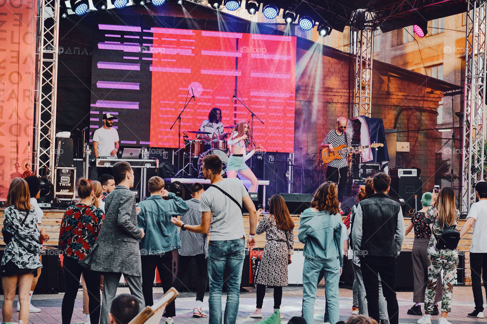 People dancing on a music festival