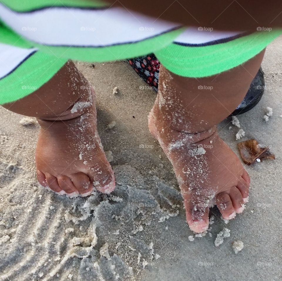 baby feet. first trip to beach 