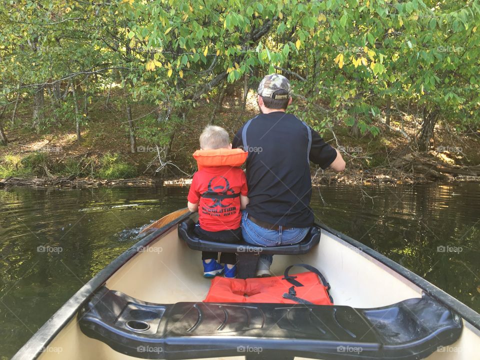 Father son paddling 