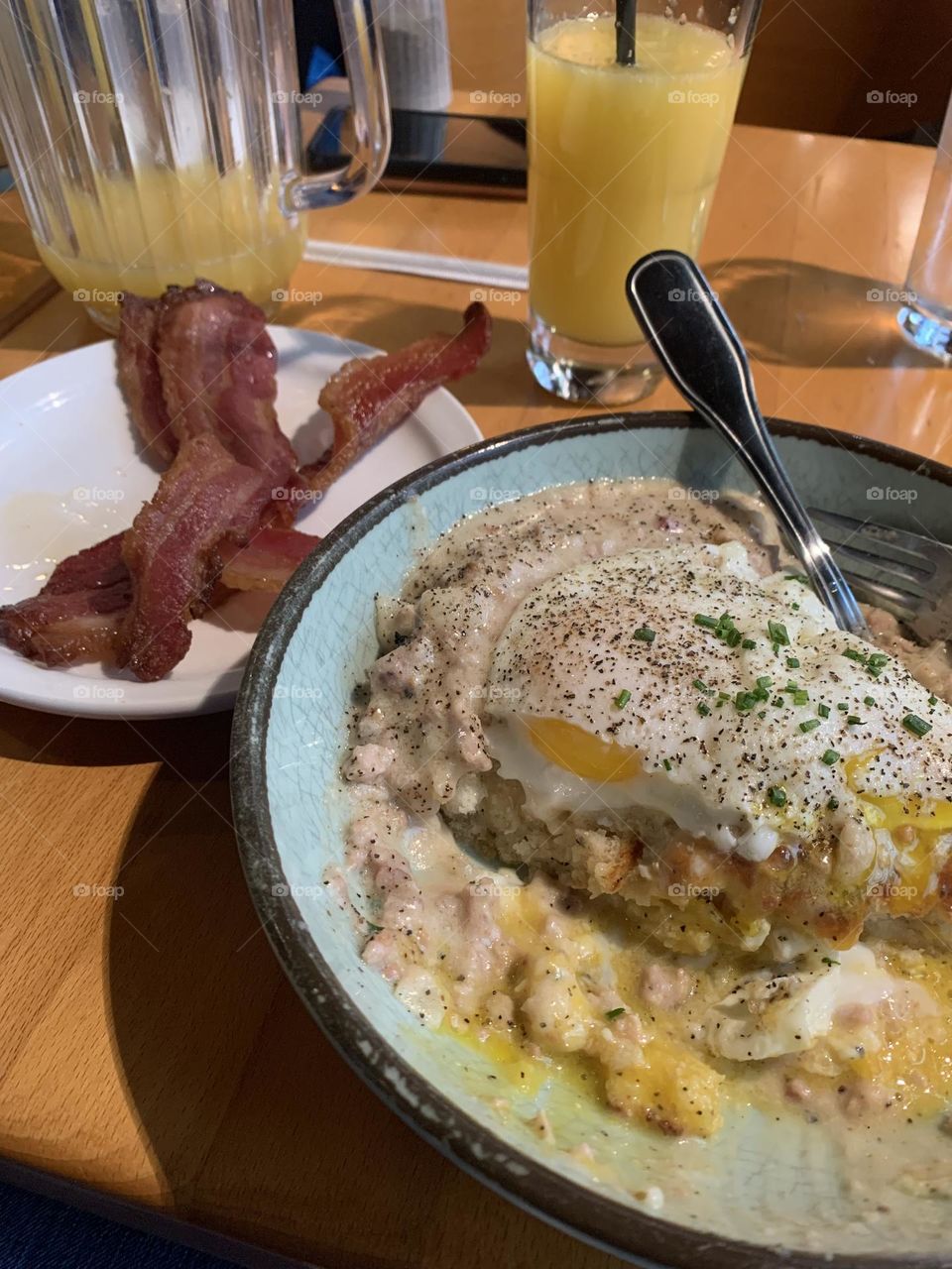 Sausage gravy with eggs and bacon. Mimosas 