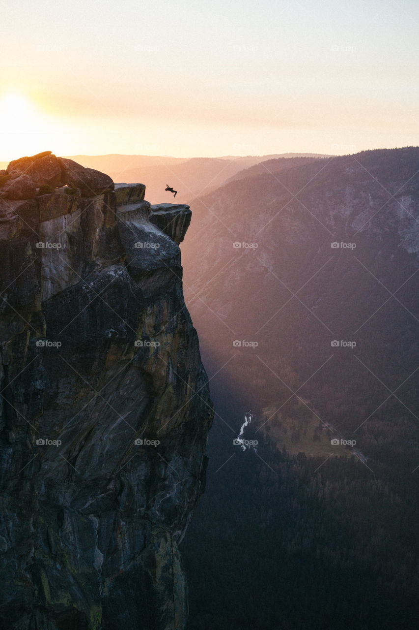 Middle of a flip during a breakdance at Taft point. Your turn to give it a try. 