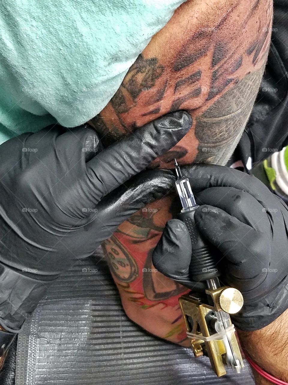 My best friend getting his tattoo sleeve finished.