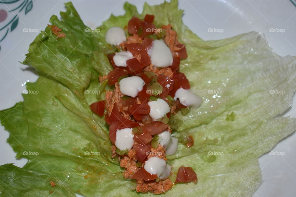 buffalo chicken lettuce wraps with celery tomatoes and ranch.