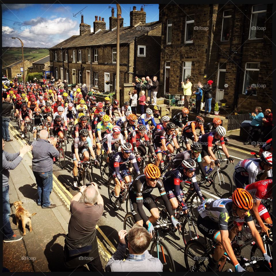 Cyclists ride through Ripponden as part of the 2015 Tour de Yorkshire.