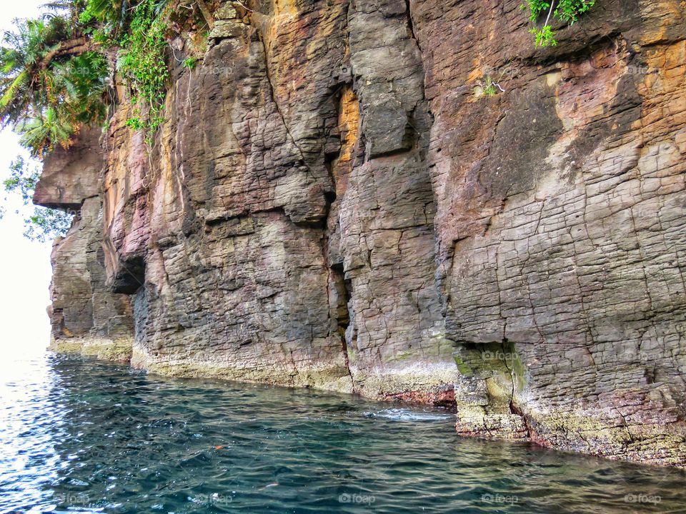 The rugged coastline is formed from a beautiful and unique rock arrangement.