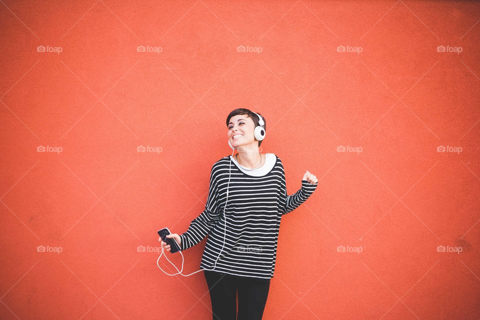 Woman listening music with headphone