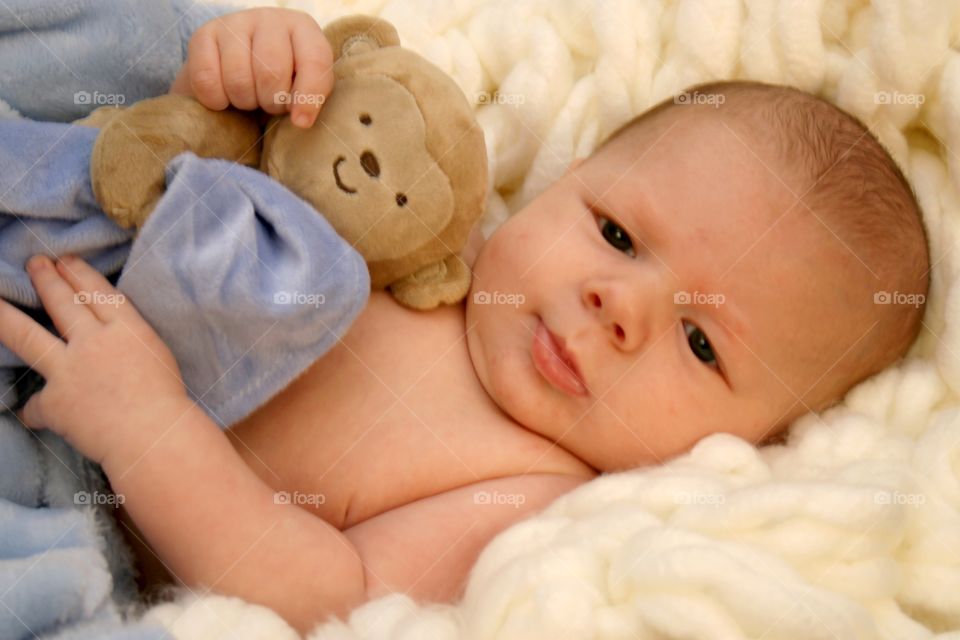 Baby boy with stuffed bear