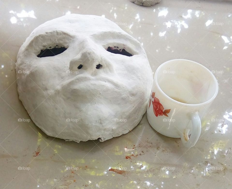 mask & tea cup
