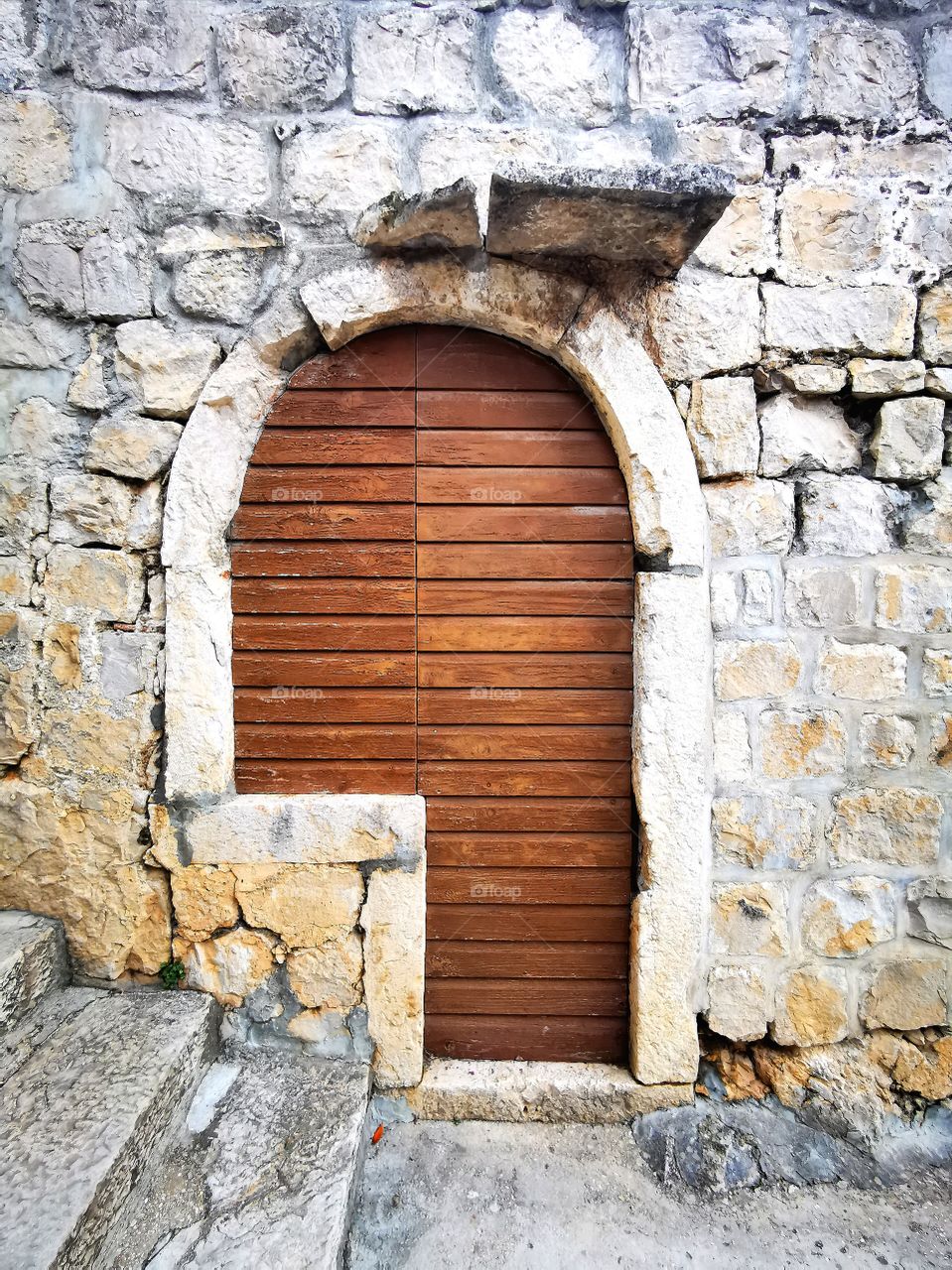 Old door in street of Cavtat