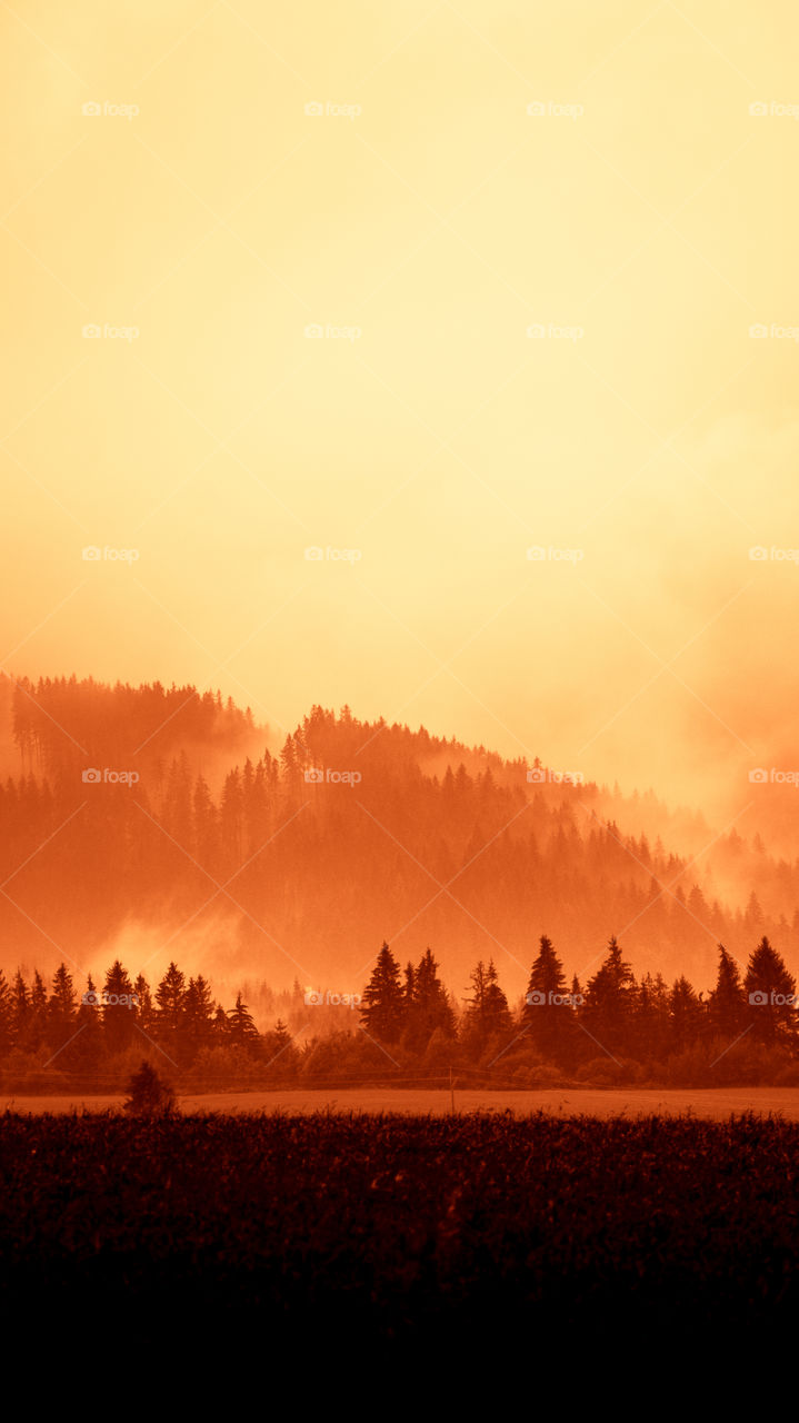 An inspiring red mountain landscape. Tatry mountains in Slovakia. A beautiful wallpaper for smartphone screen. Red abstract gradient with perspective.