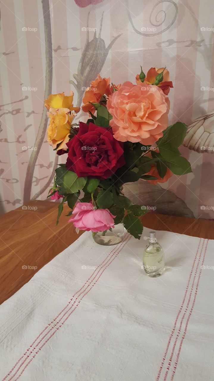 Colorful oldfashioned roses on the table