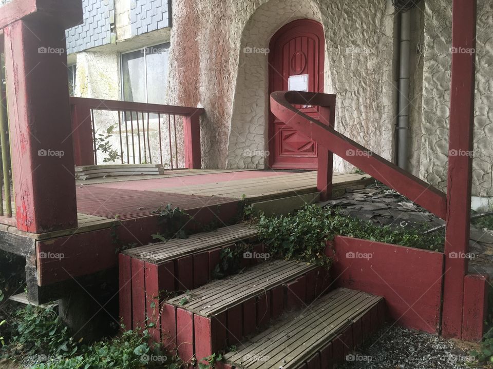 Behind entrance of abandoned discotheque