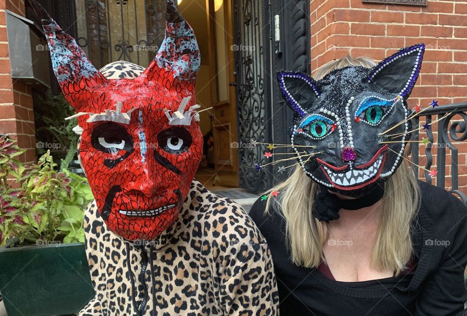 Devil and cat masks on Halloween 