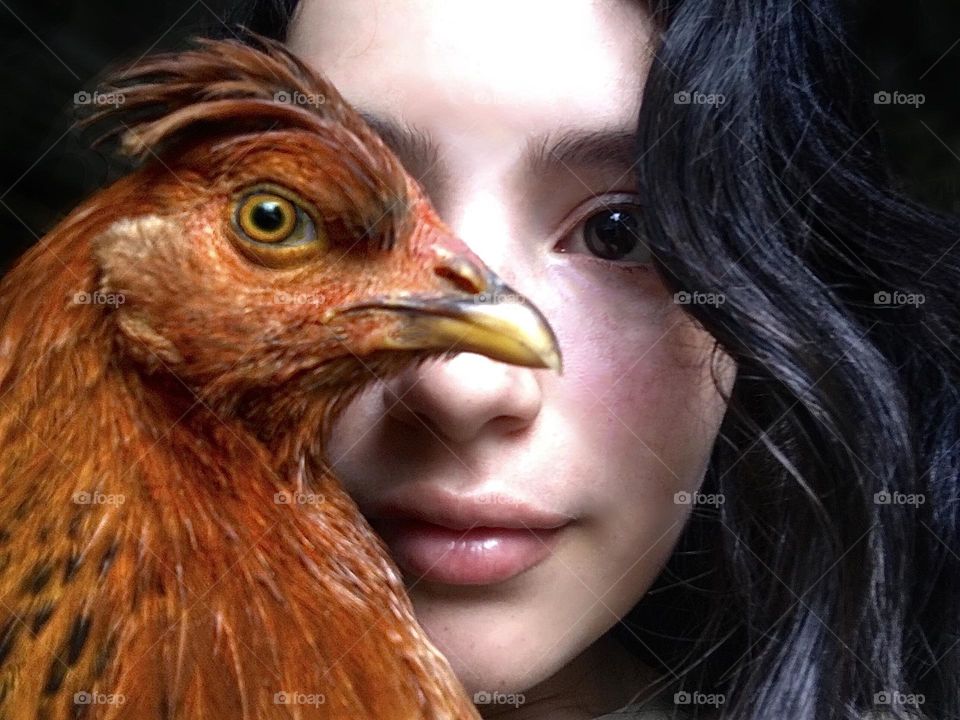 Faces. Girl and chicken
