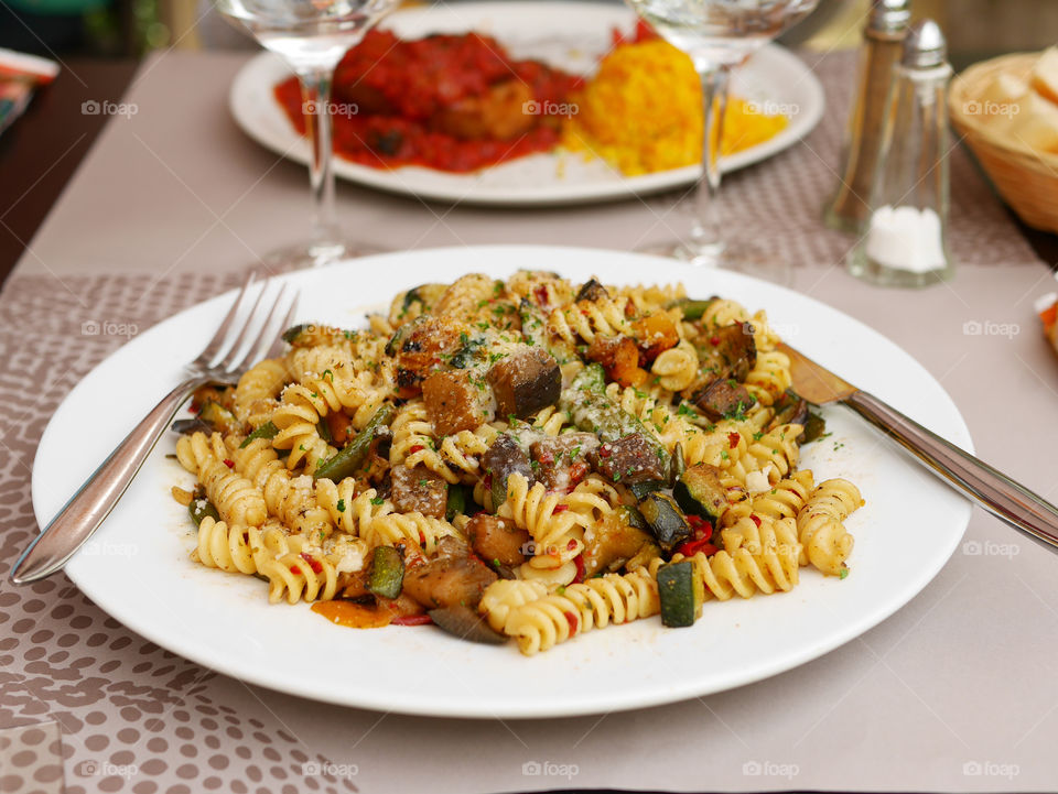 Shrimp and pasta on white plate