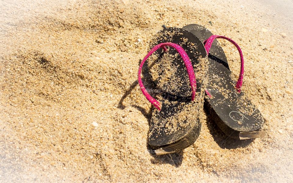 Flip flops in the sand