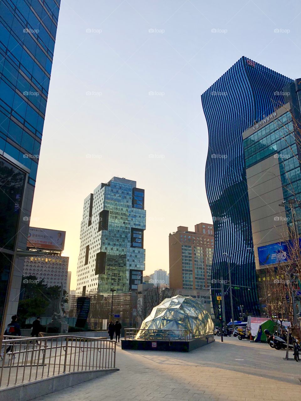 Every building is a different one in the bustling, luxurious Gangnam neighborhood of Seoul, South Korea. Truly beautiful, interesting, structural, award-winning cityscapes break through the sky around each corner. 