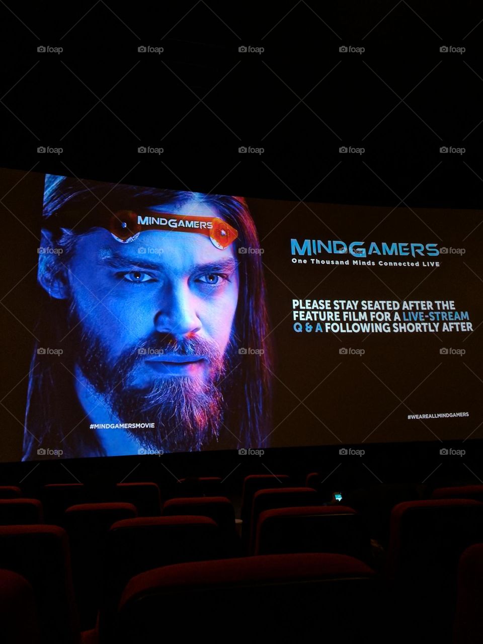 Screening of Mindgamers in a movie theater in New York with red chairs