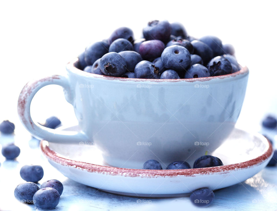 cup with blueberries