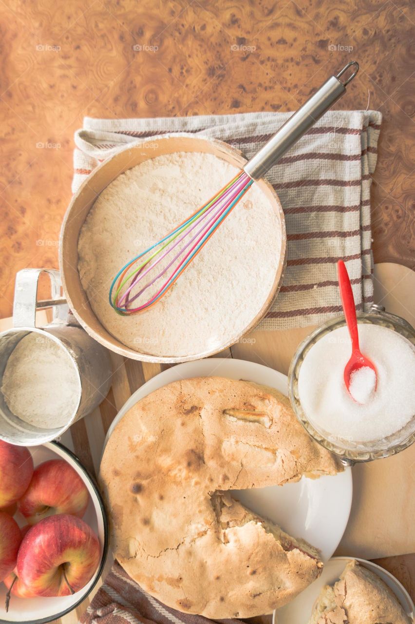 Making homemade puffed apple pie with eggs, sugar and flour.
