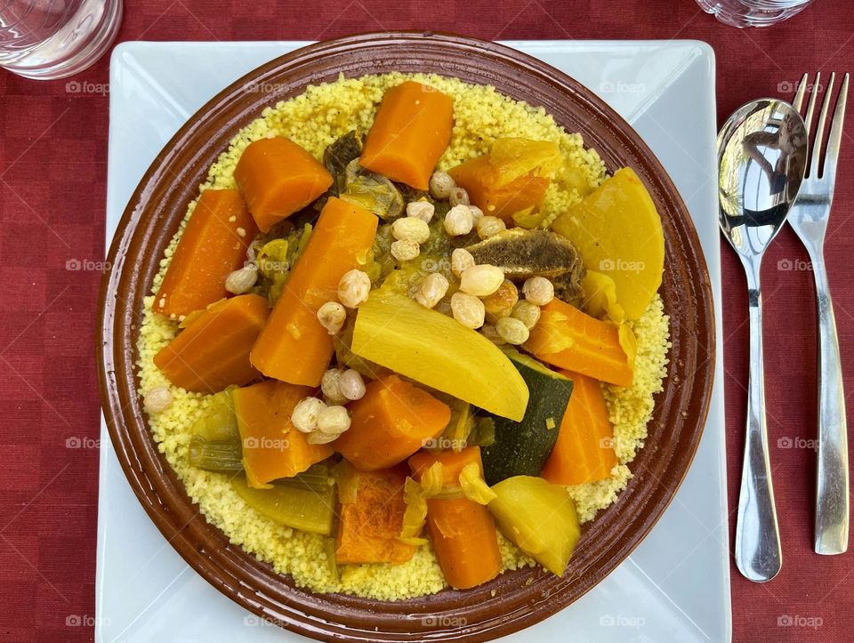 Vegetable cous cous with carrots, potatoes, zucchini and yellow grapes, Maroccan food, Arabic food, ethnic meal 