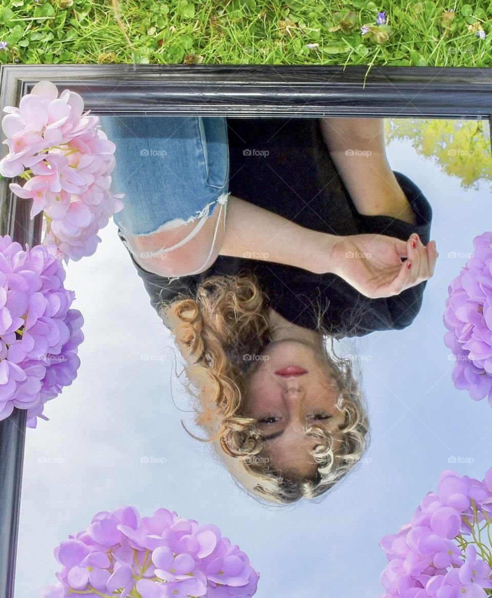 Beautiful girl reflection in mirror
