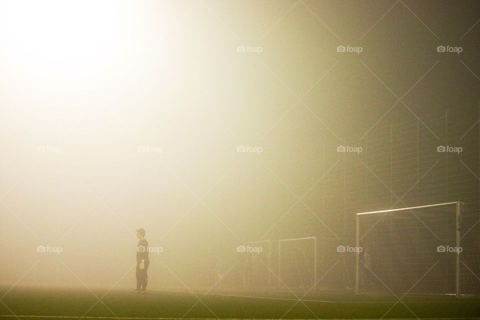 Soccer game in fog