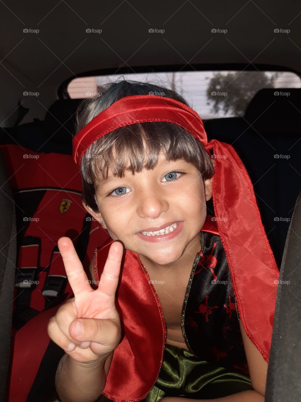 pretty child dressed as a red pirate