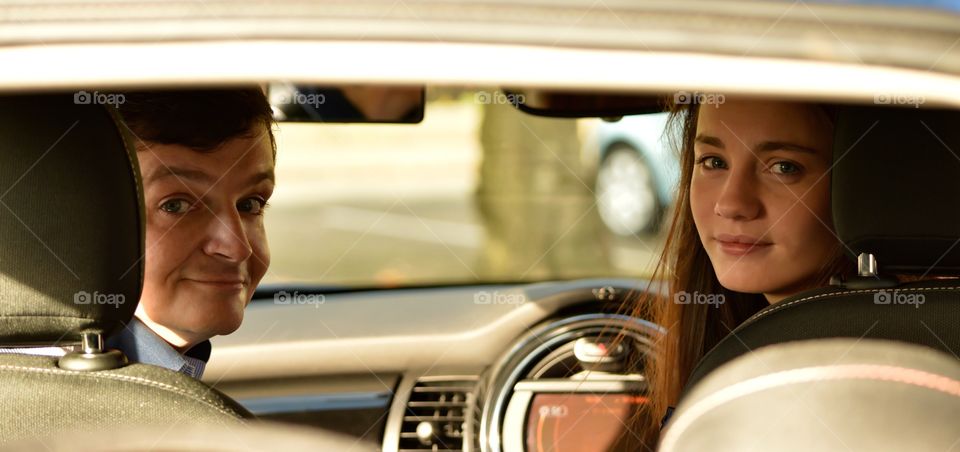 Portrait of couple sitting in the car